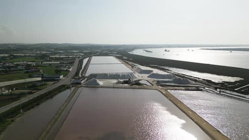 Massive salt piles in extraction site, aerial drone view