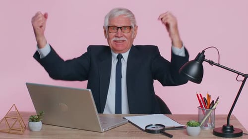 Senior Business Office Man Analyzes Financial Charts Celebrate Success Win at Home Workplace Desk