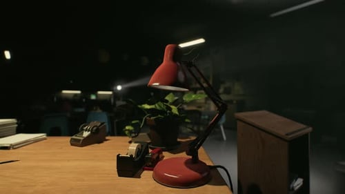 Vintage Red Desk Lamp Flickering in Dark Office