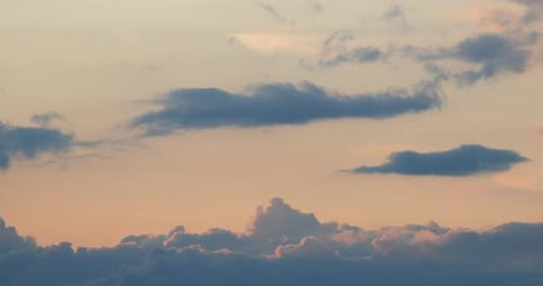 time lapse of clouds lit by the setting sun. Beautiful sunset light coloring the different clouds mo