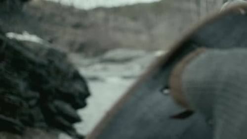 Armored Figures Fighting With Swords and Shields