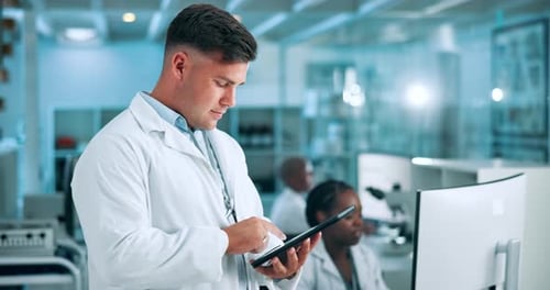 Scientist Using Tablet in Bright Laboratory