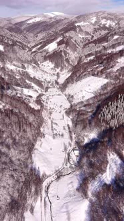 Snow Covered Mountain Valley in Winter