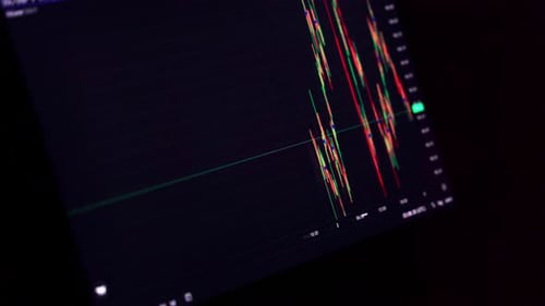 Cryptocurrency market trends displayed on a laptop screen with fluctuating price charts