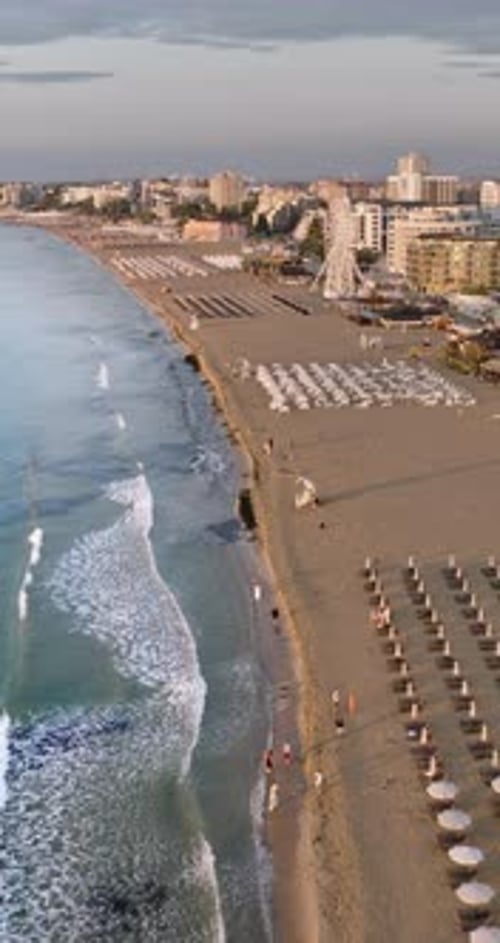Aerial drone view of the Sunny Beach resort in Bulgaria at sunset. Vertical
