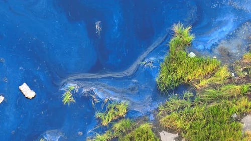 An aerial drone captures industrial wastewater flows into surface water.