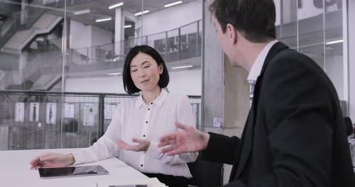 Business Professionals Discussing Project and Shake Hands