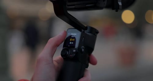 Thumb changing settings of innovative DJI Ronin RS3 Mini stabilized gimbal. Slow motion and close-up