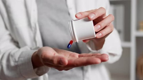 Close Up Female Hands Pour Out Pills In The Palm Of The Hand Capsule Preparations Fall Out The White