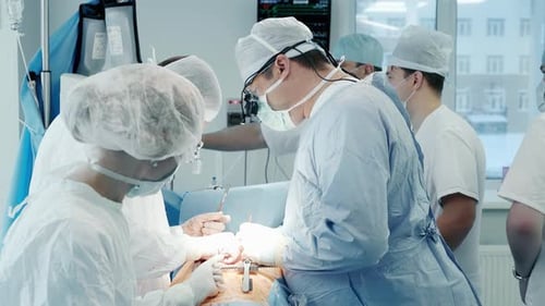 Surgeons Perform Operation in Brightly Lit Operating Room