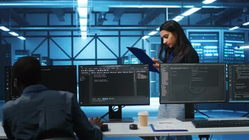 Manager in Data Center Doing Inspection on Electronics and Workers