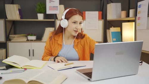 Delightful young girl is studying