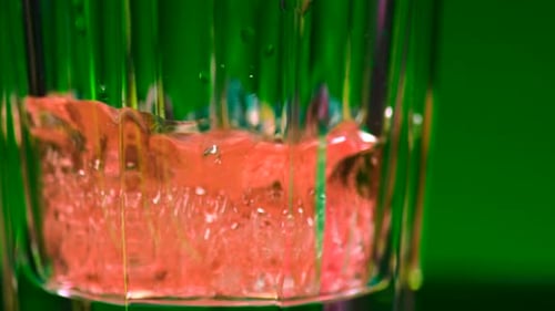 Close up of transparent glass with soda or alcohol drink