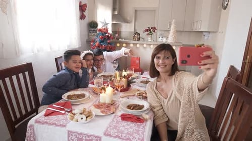 Homoparental Family Taking a Selfie During Christmas Lunch