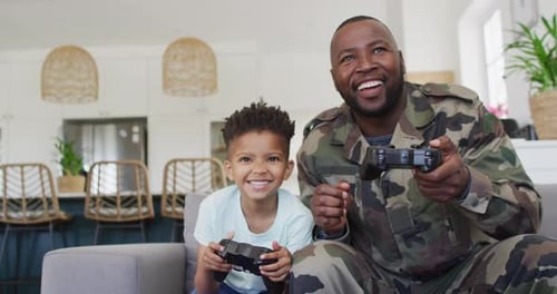 Dad and Son Gaming Together at Home