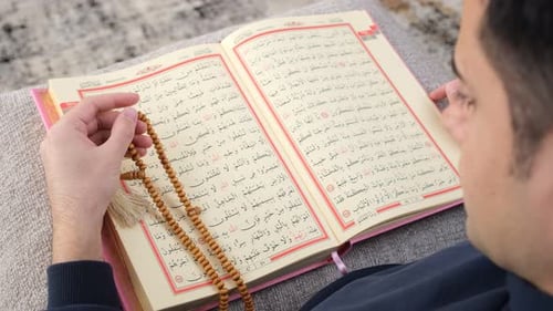 Muslim man rosary Quran