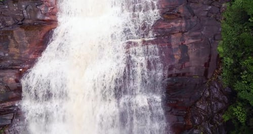 Exploring Majestic Waterfalls Cascading Down Massive Tropical Jungle Mountain Cliffs