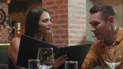 Couple Checking Restaurant Menu