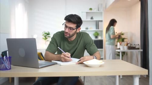 Man Working at Desk at Home