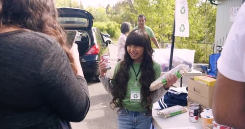 Happy Volunteer Girl at Food Drive