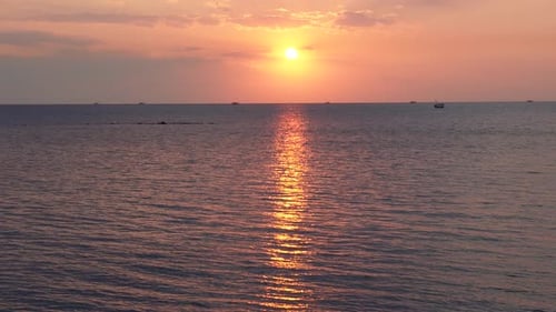 Beautiful aerial sunset view over sea surface beautiful wave. Amazing light sunset or sunrise sky ov