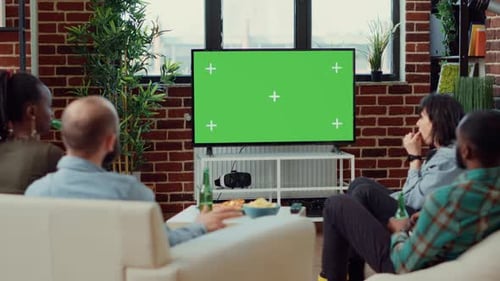 Friends Watching Green Screen TV at Home
