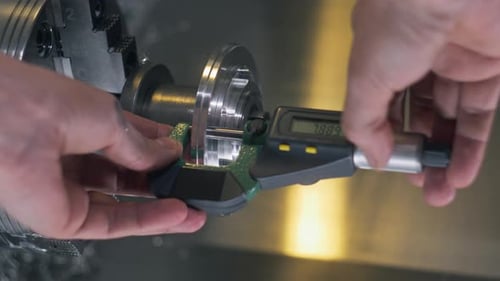 Technician Makes Measures By Electrical Micrometer