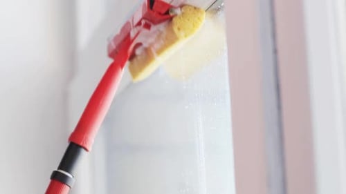 Window Washing with Sponge Cleaning Tool in Home