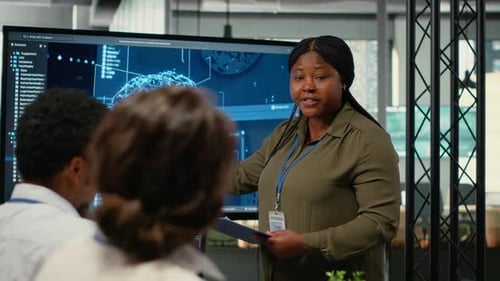 Business Woman Leading Presentation in Modern Office