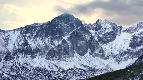 Aerial Winter Drone Footage of Snow Mountain Range Landscape in Alps