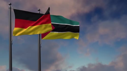 Germany and Mozambique Flags Waving in Cloudy Sky