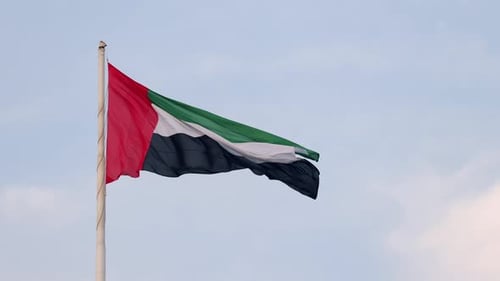 UAE Flag Waving in the Blue Sky National Symbol of UAE