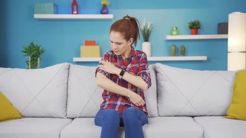 Young woman with itchy arms.