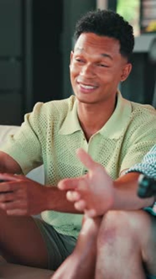 Smiling Man Talks Indoors