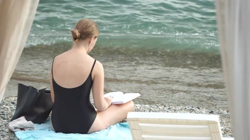Woman Reading Book and Sitting on the Beach on Vacation Summer Holidays Travel Concept Summer Chill
