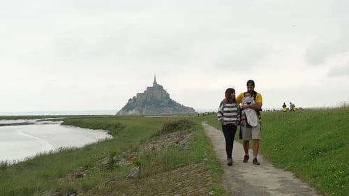 A family of tourists visiting the famous Mont Saint-Michel in the Manche department, Normandy region