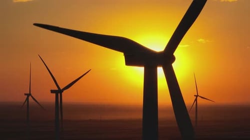 Drone shot of windmill during sunset