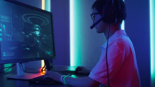 Teen Gamer Playing Futuristic Video Game at Night