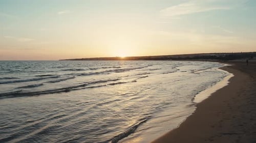 Sunrise Over The Calm Ocean
