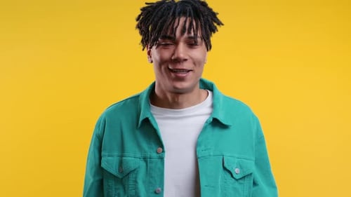 Young Adult Smiling and Raising Hands