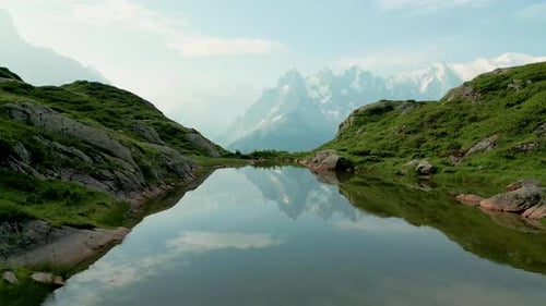 Aerial view of alpine lake and mountains, France.