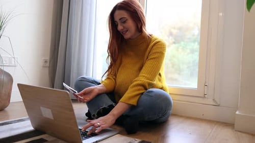 pregnant redhead woman with ultrasound, ultrasound top view. belly of pregnant woman making notes fe