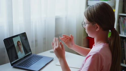 Teen Girl Attends Online Class at Home