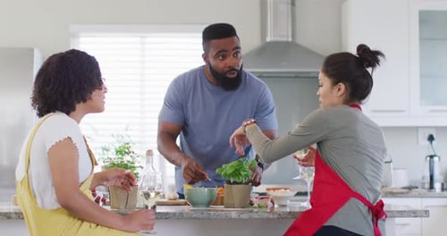 Friends Cooking Together in Modern Kitchen, Drinking Wine