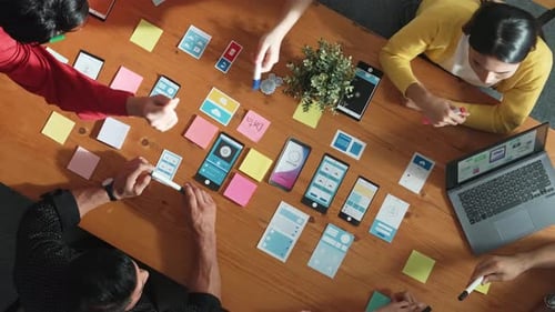 Team putting hand together while brainstorm about Ux Ui design. Convocation.