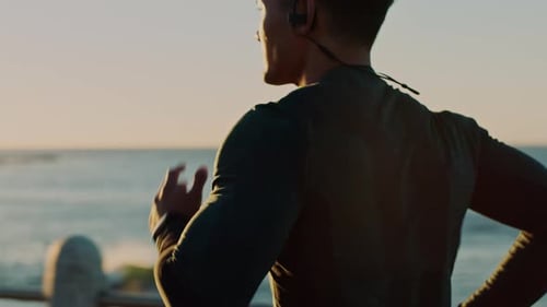 Fitness, beach or sports man running or training for a marathon with cardio exercise