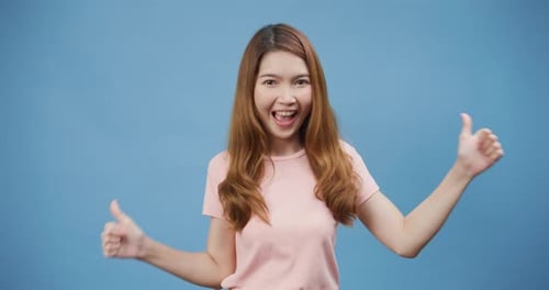 lady wear casual pink smile show thumps up with positive of content and happy stand isolate.