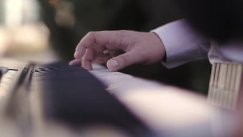close-up of pianist's hands, piano playing