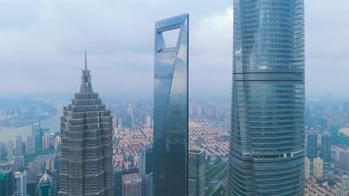 Aerial Drone Shot of the Shanghai Tower Shanghai World Financial Center and Jin Mao Tower Rising