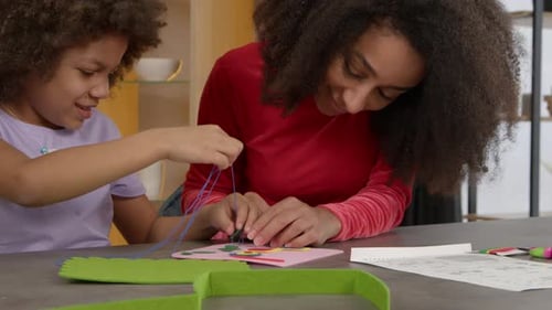 Portrait of Adorable Little Black Girl and Mother Sewing Handmade Kids Bag